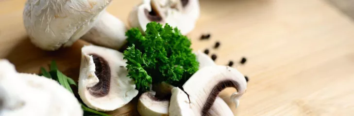 mushrooms and herbs on cutting board
