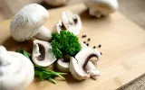 mushrooms and herbs on cutting board